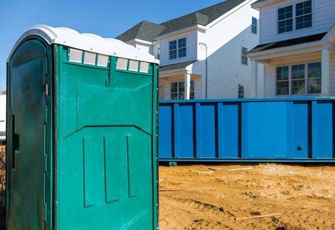 essential amenities at a bustling job site porta potties